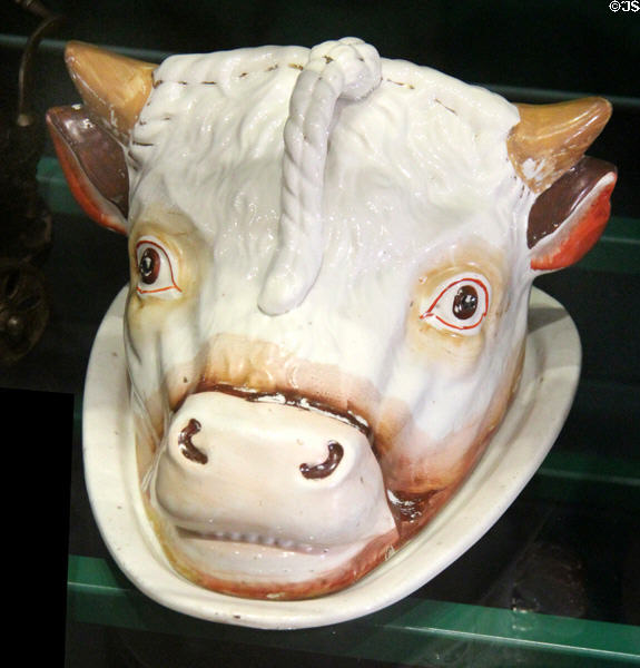 Ceramic cheese dish in shape cow's head, used to keep cheese from drying out, on display at St Fagans National Museum of History. Cardiff, Wales.