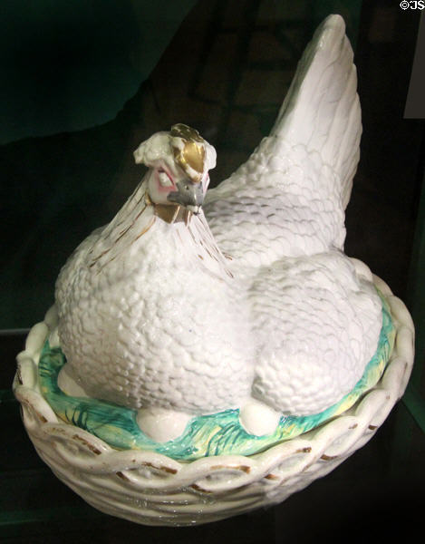 Ceramic "egg nest" in shape of hen lying on her eggs, used to keep eggs warm on breakfast table, on display at St Fagans National Museum of History. Cardiff, Wales.