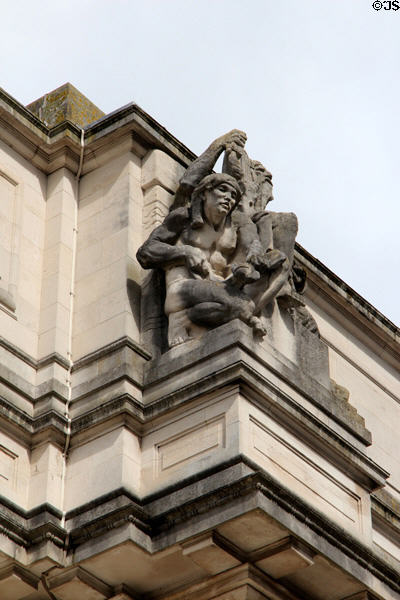 Pre-historic Period sculpture (c1922) on facade of National Museum of Wales, attrib. Gilbert Bayes,. Cardiff, Wales.