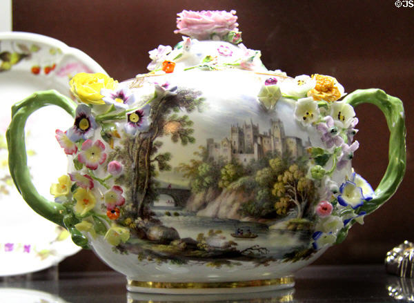 Porcelain highly ornamented teapot with applied porcelain flowers (c1816) from Swansea at National Museum of Wales. Cardiff, Wales.