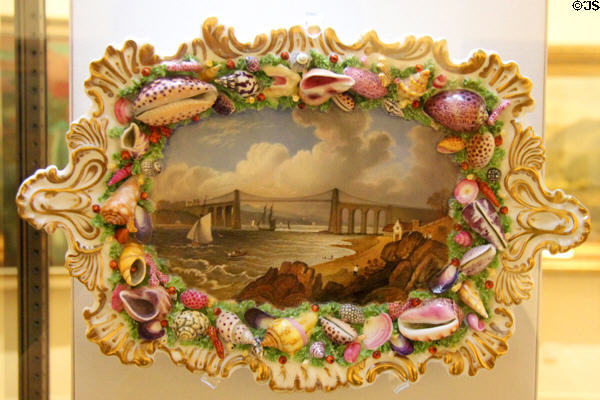 Menai Bridge painting with highly ornate ceramic frame decorated with various sea shells at National Museum of Wales. Cardiff, Wales.