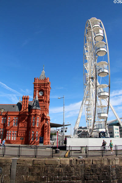 Red terracotta Pierhead building & Ferris wheel at Cardiff Bay. Cardiff, Wales.