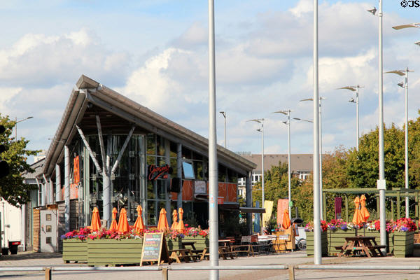 Modern restaurant building with outdoor seating at Cardiff Bay. Cardiff, Wales.