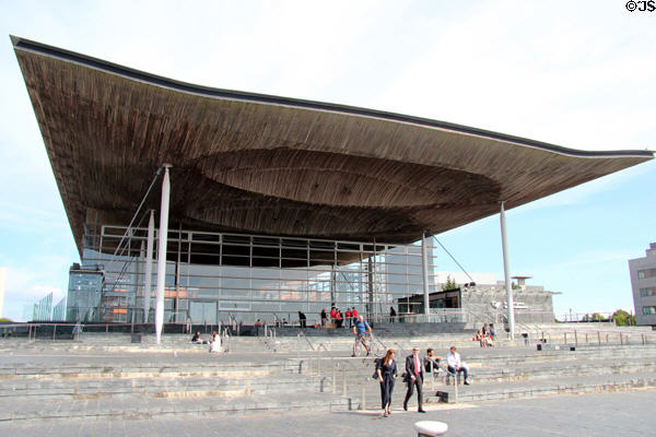 Senedd Cymru (aka Welsh Parliament) (2006), designed, with its glass walls & open floor plan to reflect open democracy, at Cardiff Bay. Cardiff, Wales. Architect: Richard Rogers & Ivan Harbour.