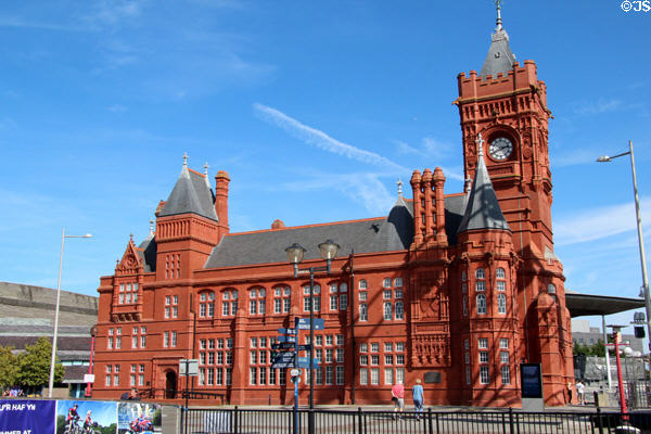 Western facade of the Pierhead building (1897) now belonging to the Senedd Cymru (Welsh parliament) with exterior of red glazed terracotta blocks at Cardiff Bay. Cardiff, Wales. Architect: William Frame.