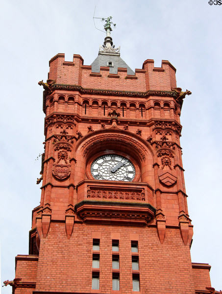 Clock face, finial & gargoyles on the Pierhead building at Cardiff Bay. Cardiff, Wales.