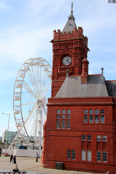 The Pierhead building with Ferris wheel in background at Cardiff Bay. Cardiff, Wales.