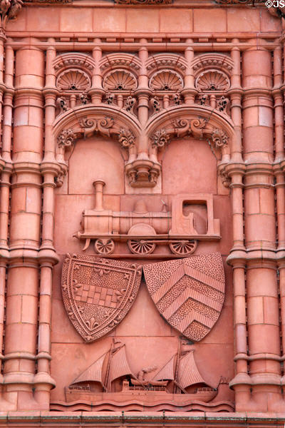 Terracotta panel with train engine & sailing ship on the Pierhead building at Cardiff Bay. Cardiff, Wales.