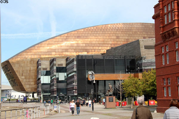 Wales Millennium Centre (2004 & 2009), which serves as the national arts centre, constructed of steel treated with carbon oxide for the roof & recycled multi-colored Welsh slate for exterior, at Cardiff Bay. Cardiff, Wales. Architect: Jonathan Adams, Part 1 ; Tim Green & Keith Vince, Part 2.