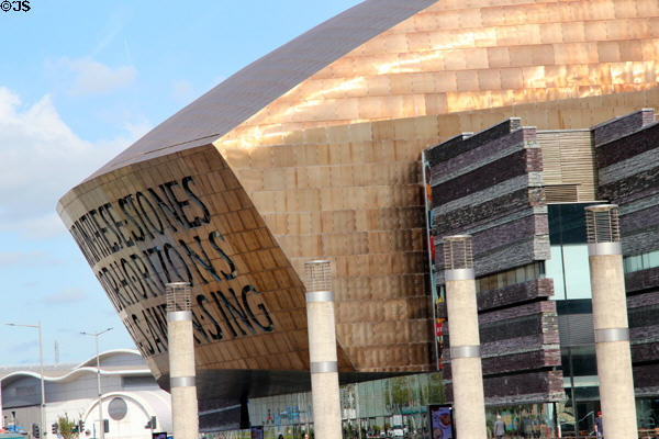 Front entrance showcasing the Bronze colored roof & multi-colored Welsh slate walls. Cardiff, Wales.