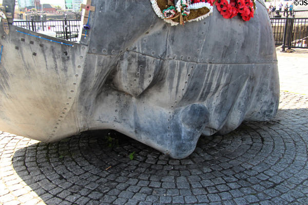 Hull of wrecked ship evolves into face of drowned sailor on Merchant Seafarers War Memorial at Cardiff Bay. Cardiff, Wales.