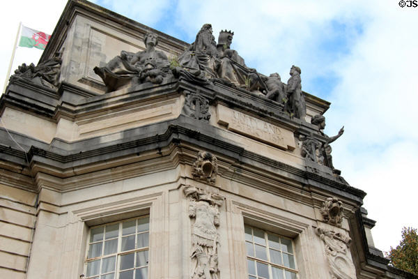 Statuary with motto "Unity And Patriotism" on Cardiff Crown Court. Cardiff, Wales.