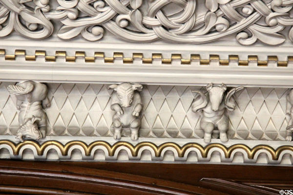 Sculpted plaster fantasy figures along border between wall & ceiling in Library at Penrhyn Castle. Bangor, Wales.