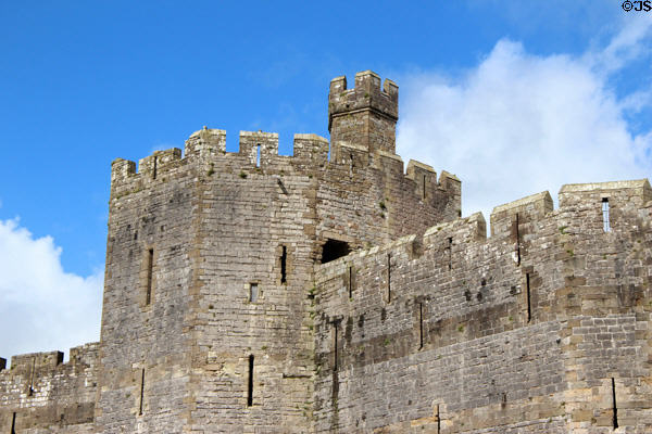 Polygonal tower set into massive walls at Caernarfon Castle. Caernarfon, Wales.