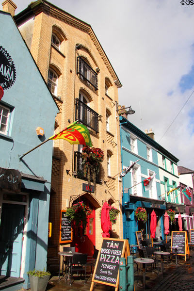 Shops & flags along Palace St. Caernarfon, Wales.