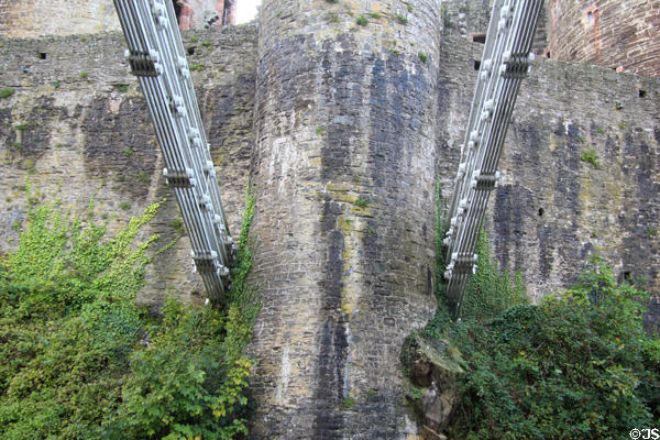 Supporting chains of Telford suspension bridge anchored in Conwy Castle towers. Conwy, Wales.