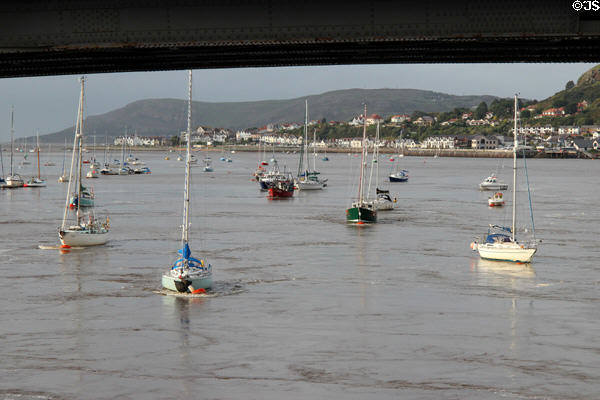 Boats anchored in Conwy harbor, part of the Conwy River leading to the Irish Sea. Conwy, Wales.