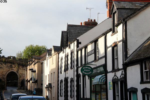 Road leading into old town through stone archway. Conwy, Wales.