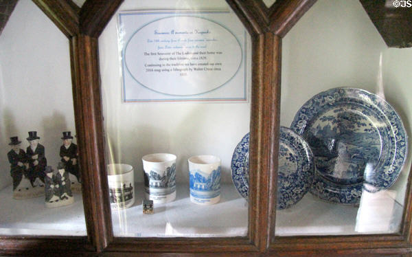 Contemporary souvenir mugs with design based on lithograph (c1835) by Walter Crane at Plas Newydd. Llangollen, Wales.