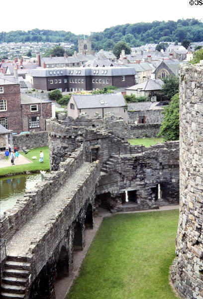 Section of the wall of Beaumarais Castle with town in background. Beaumarais Anglesea, Wales.