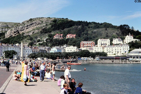 Visitors enjoying the sunshine at Colwyn Bay in North Wales.