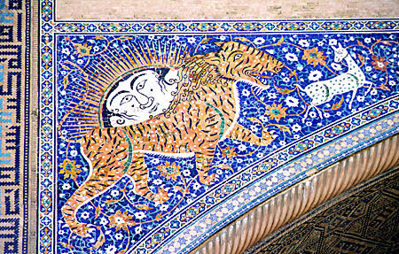 Mosaic showing tiger hunting deer on Shir Dor Madrasah at Registan mosque in Samarkand. Uzbekistan.