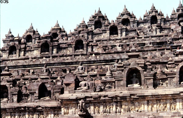 Carvings on Borobudur are earthly below & heavenly at higher levels. Indonesia.