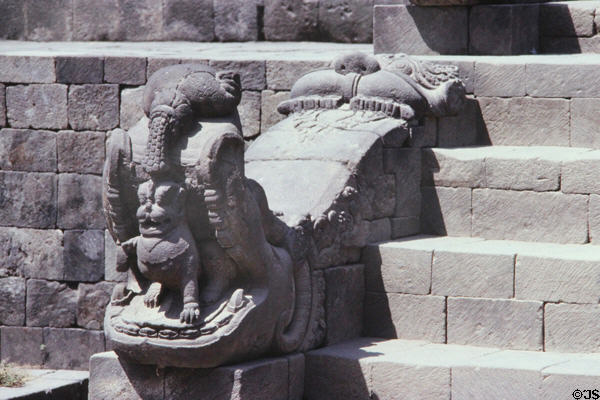 Railings on steps carved with mythical beasts at Borobudur. Indonesia.