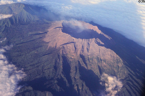 Smoking volcano near the eastern end of Java seen from the air. Indonesia.