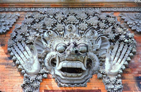 Carving of god with two raised hands. Bali, Indonesia.