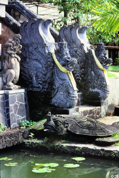Two winged guardians form stair railings. Bali, Indonesia.