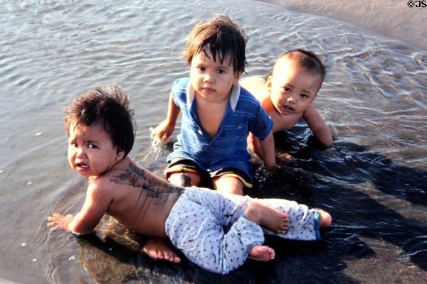 Children wading in sea. Bali, Indonesia.