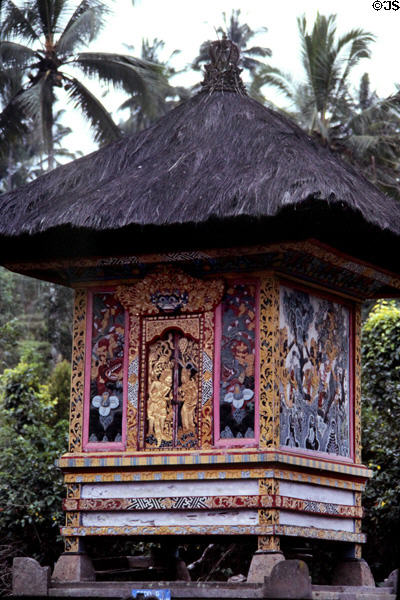 Shrine (meru) with thatched roof & painted exterior. Bali, Indonesia.