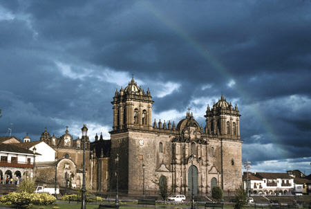 Rainbow over Cathedral in Cusco. Peru.