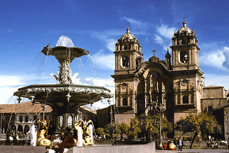 Plaza de Armas triton fountain & La Compaña church, Cusco. Peru.