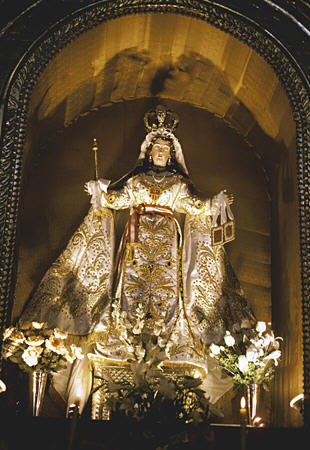 Crowned Virgin figure within La Merced church in Cusco. Peru.