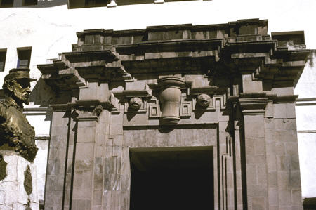Neo-classical / Mestizo-style portal opposite La Merced, Cusco with statue of Peruvian hero Captain Juan B. Zuhianca. Peru.