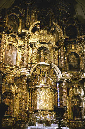 Gold altar of Oropesa village church. Peru.
