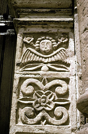 Cherub carving on church facade in Pucara. Peru.
