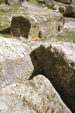 Quarry with unfinished stone with handles in Silustani (Sillustani). Peru.