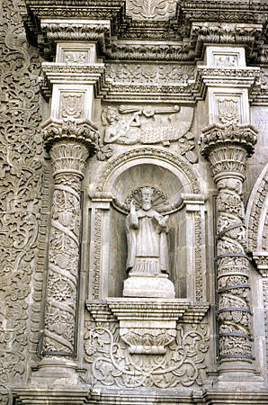 Detail of mermaid playing guitar on Puno Cathedral facade. Peru.