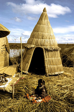 Conical reed hut on Uros Floating Islands in Lake Titicaca. Peru.