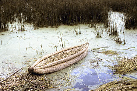 Reed boat in reeds on Lake Titicaca. Peru.