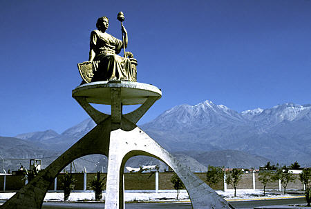 Constitution Statue at Arequipa airport set against jet fighter & Misti Volcano. Peru.