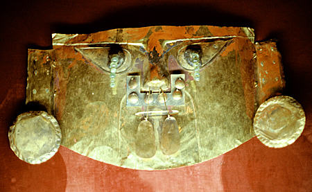 Lambayeque funeral mask (c1000 CE) (from north coast of Peru) with emerald tears & cinnabar in Gold Museum, Lima. Peru.