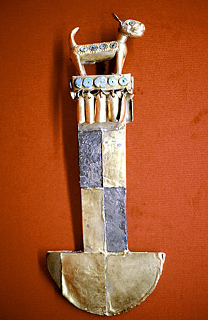 Lambayeque tumi in silver, gold & turquoise knife used for surgery is topped by Viringo (hairless dog) which had body temperature of 39°C was used for warmth by natives in Gold Museum, Lima. Peru.