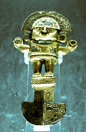 Lambayeque tumi with human figure in gold with turquoise in Gold Museum in Lima. Peru.