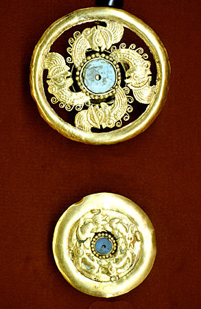 Lambayeque gold with turquoise earplugs in Gold Museum, Lima. Peru.