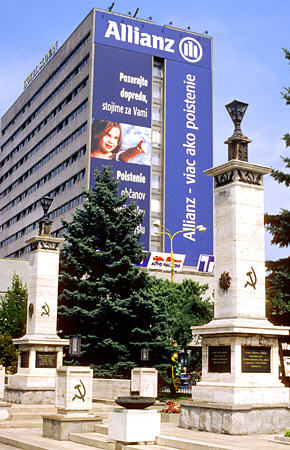 Communist monument in Kosice now overshadowed by commercial ads. Slovakia.