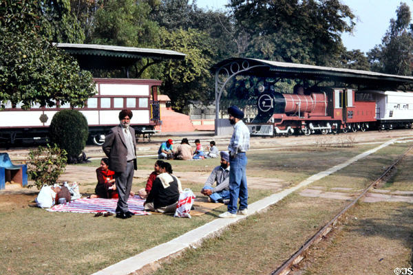 Indians picnic on grounds of Railroad museum. Delhi, India.
